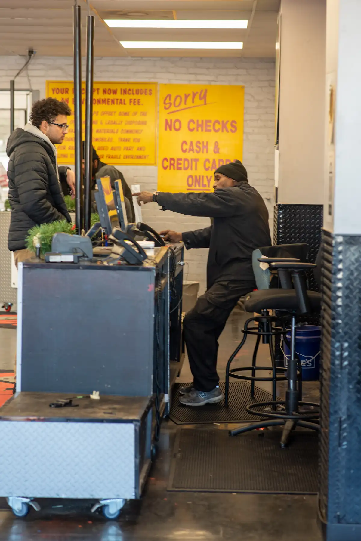 DSC_8758 Customer being helped by an employee at a self-serve salvage yard